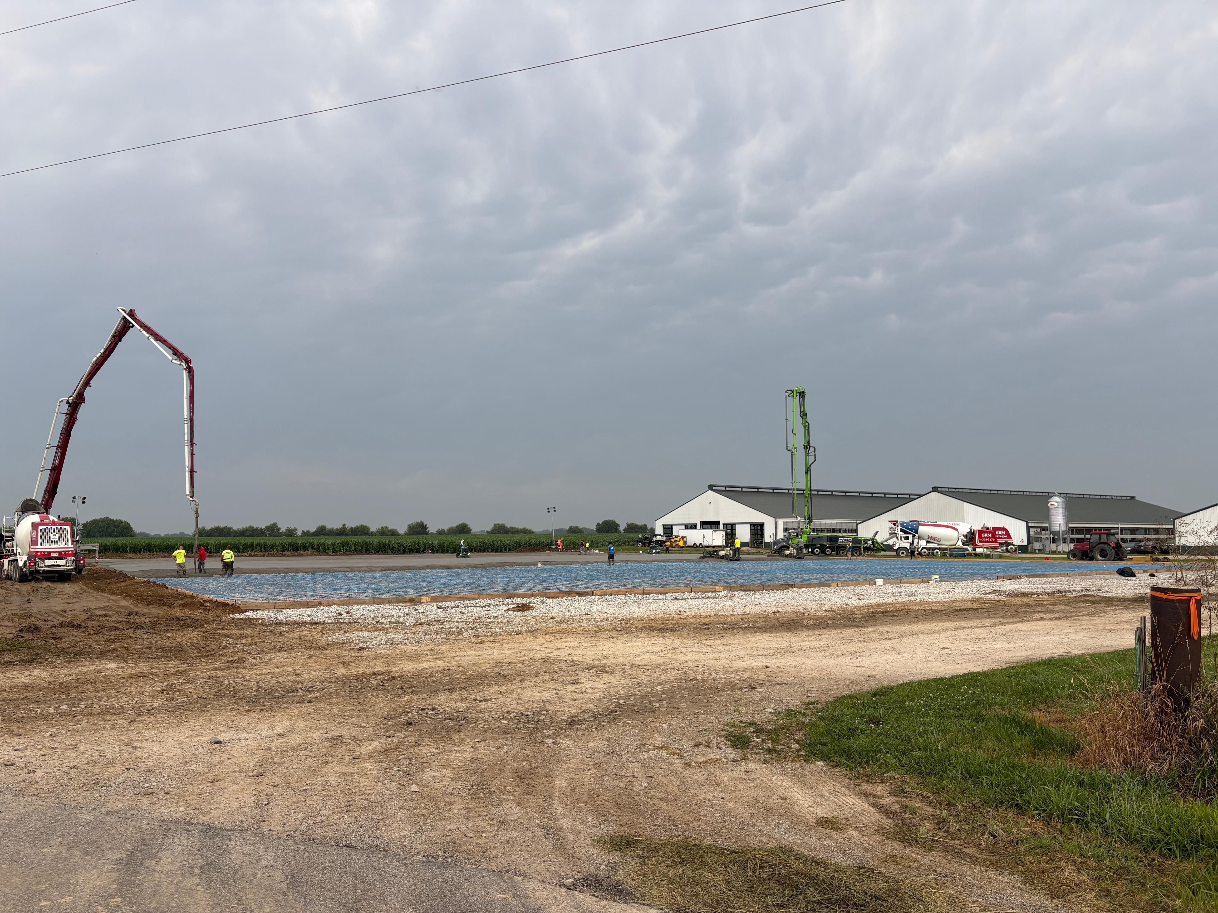 Rapid-Crete boom pumps supporting a large slab pour